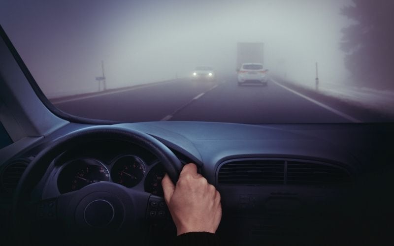 Man driving in the fog