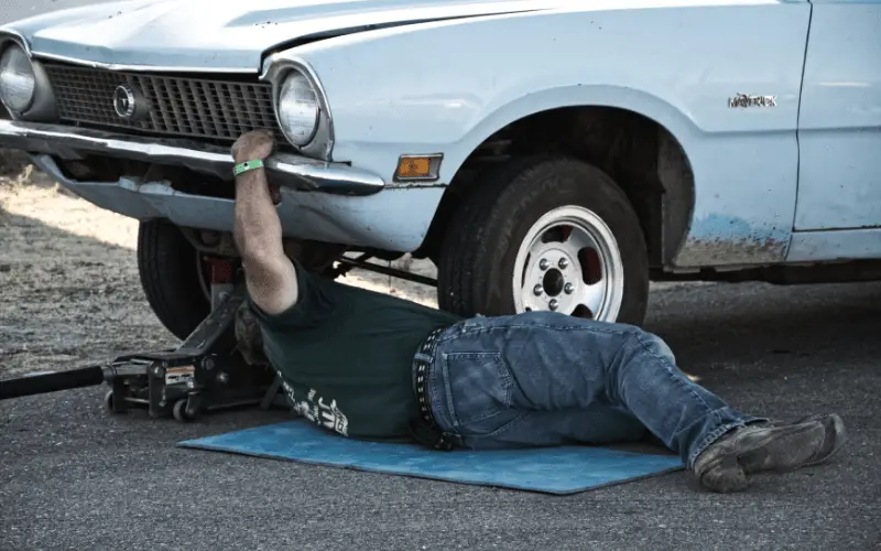 a man working under his car